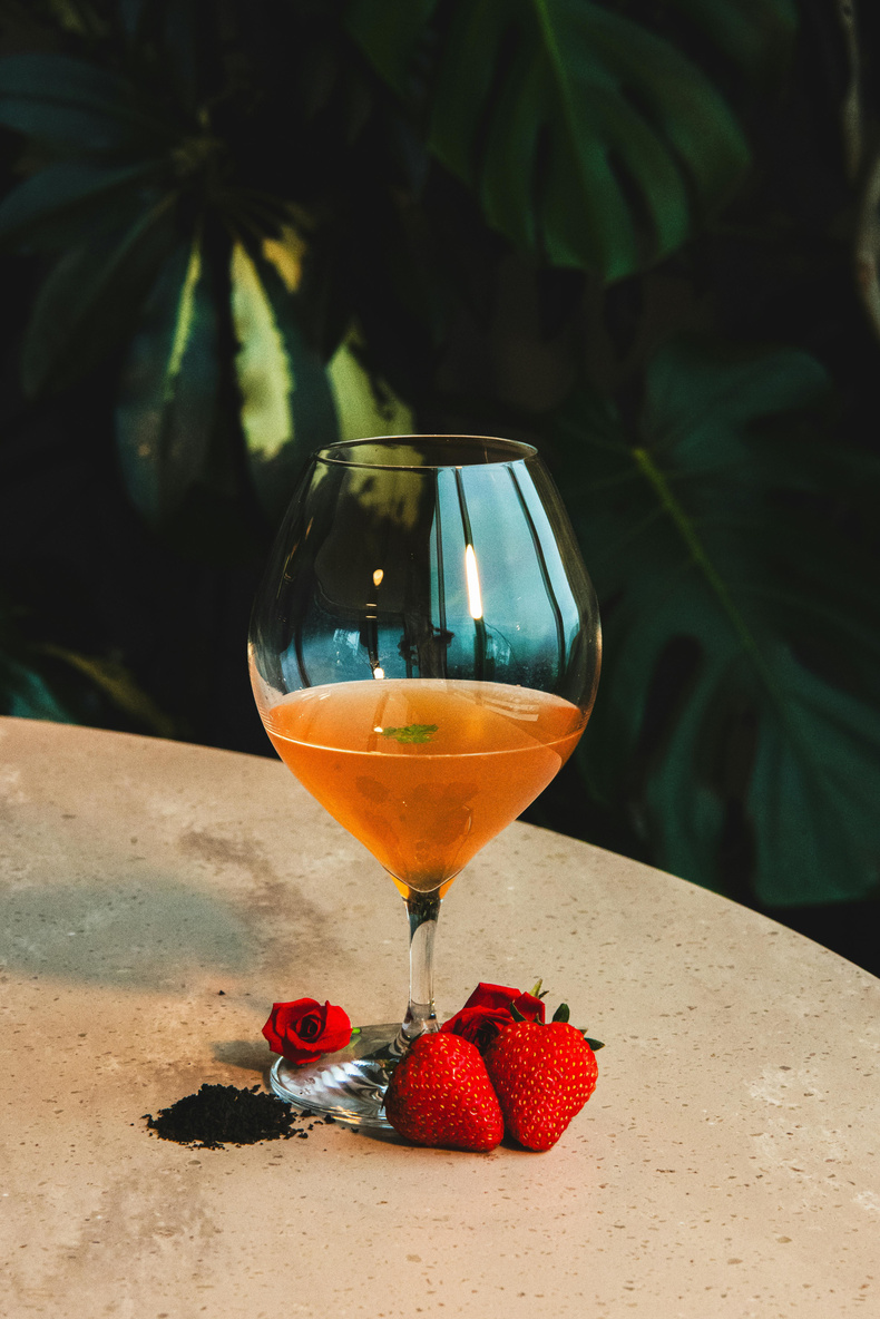 Coupe with feather garnish on velvet